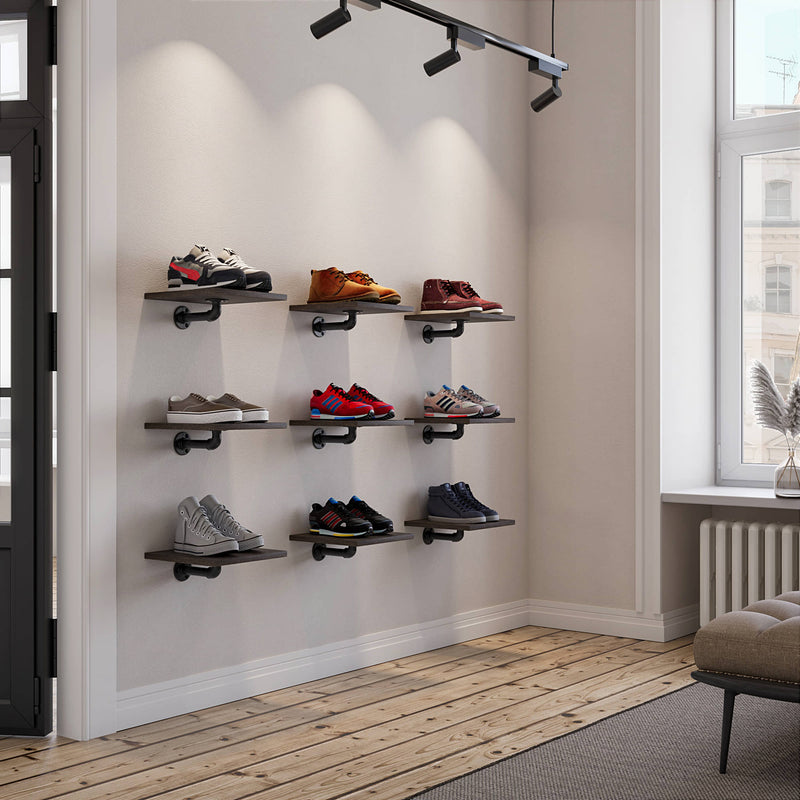 Display wall for sneaker collection made from square wooden shelves and iron pipes