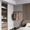 clothes rail mounted to the wall made from strong black coated iron pipes for the bedroom