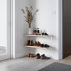 simplistic shoe rack made from two floating wall shelves made from white iron supports and classic oak shelves