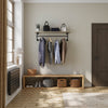 wall mounted clothes rail for jackets in the entrance with shelf in oak for decoration on top